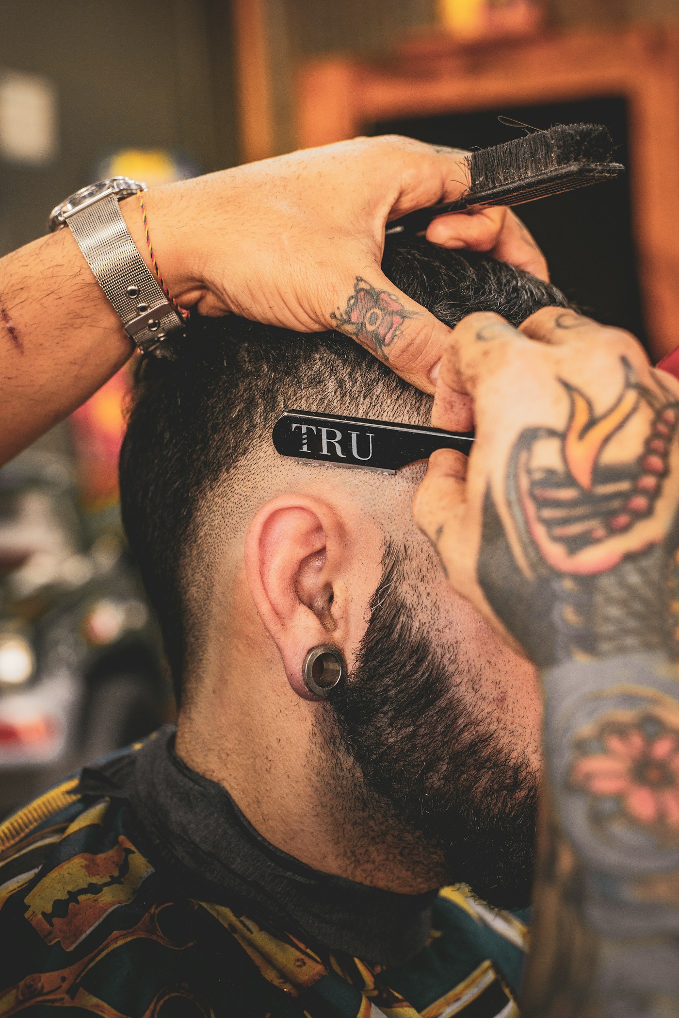 Barber giving a precise haircut